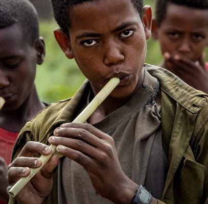 Ethiopian boy playing the flute