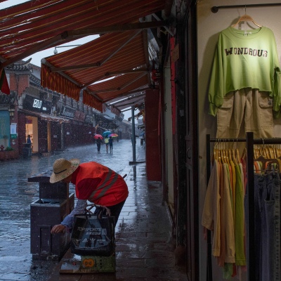 The sanitation worker in the rain